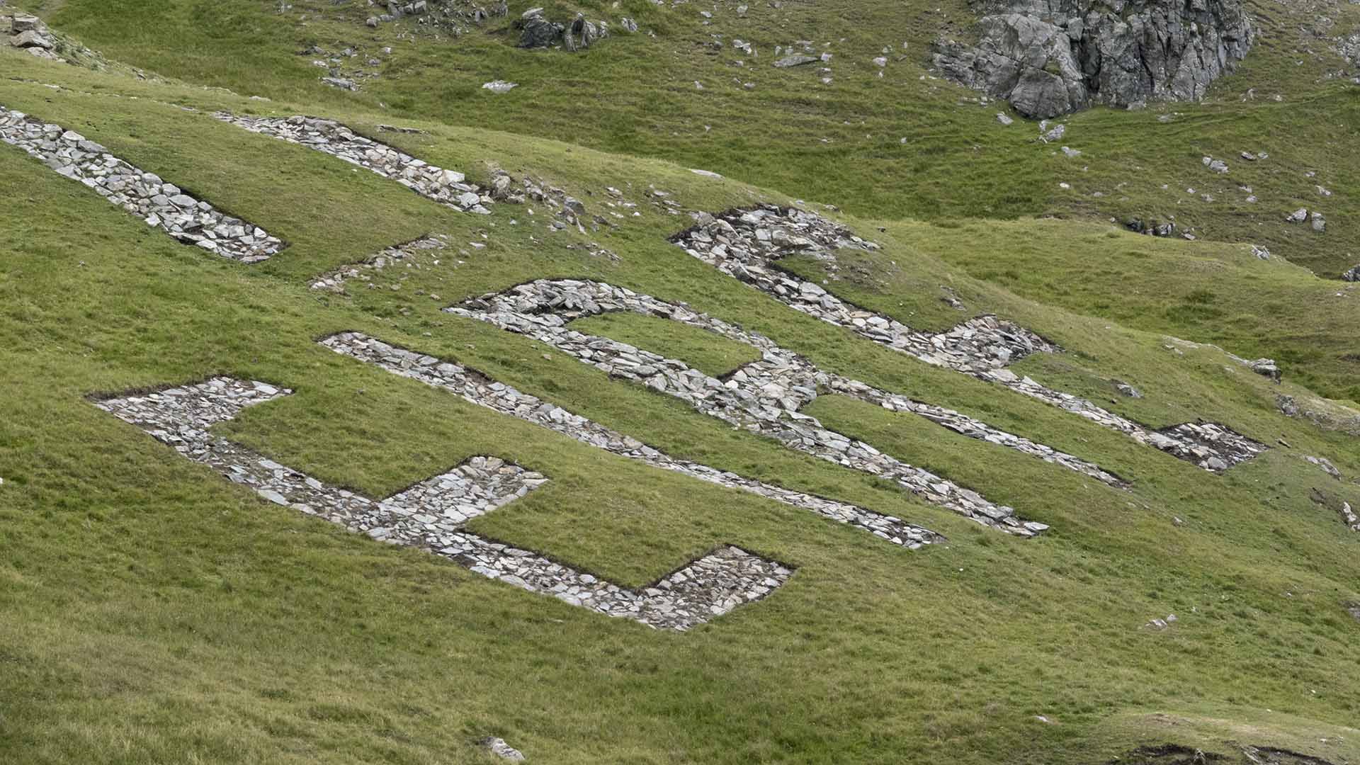 Eire in stone letters carved into a grassy hill  Sliabh League 