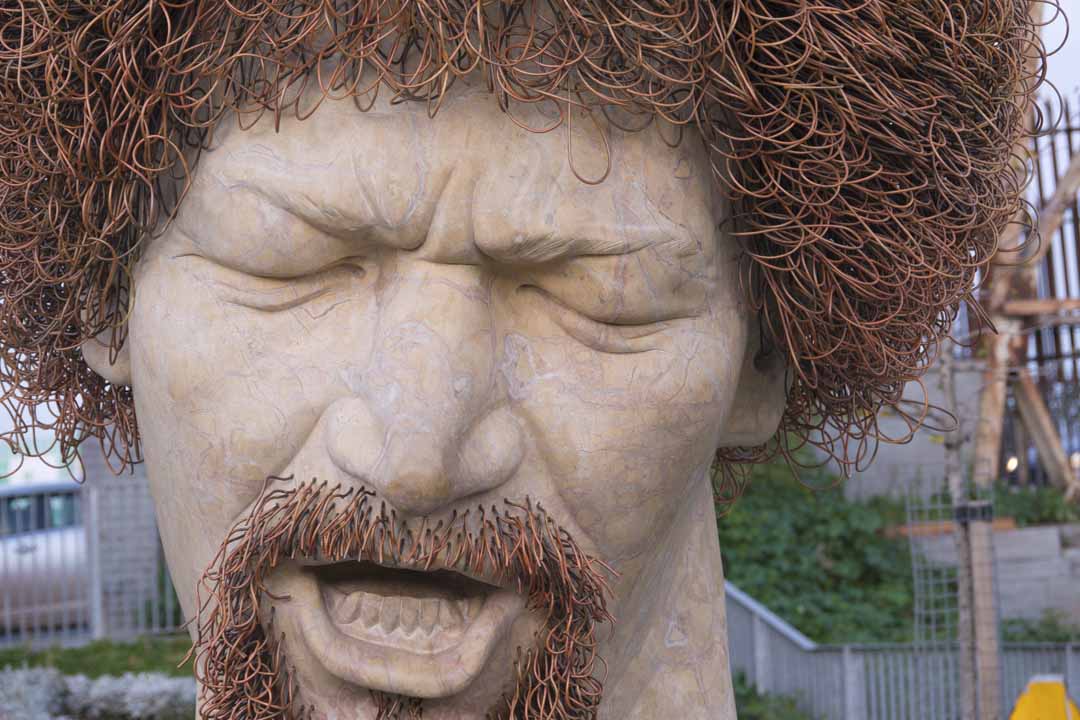 A close up of the Luke Kelly statue.