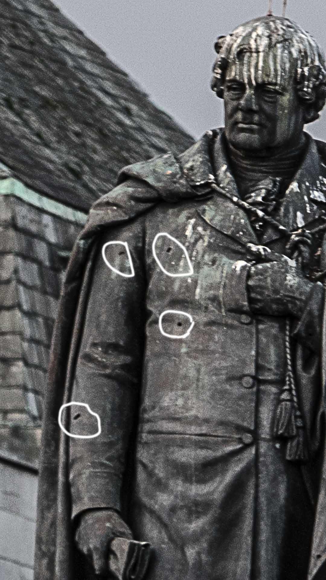 Highlighting bullet holes in statue from 1916