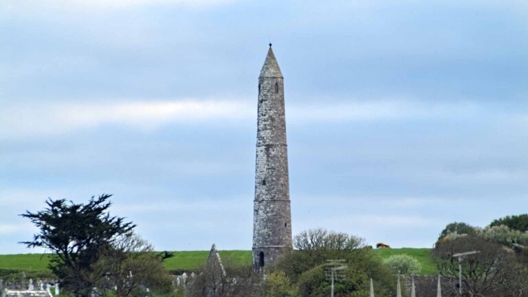 a tall tower in a field