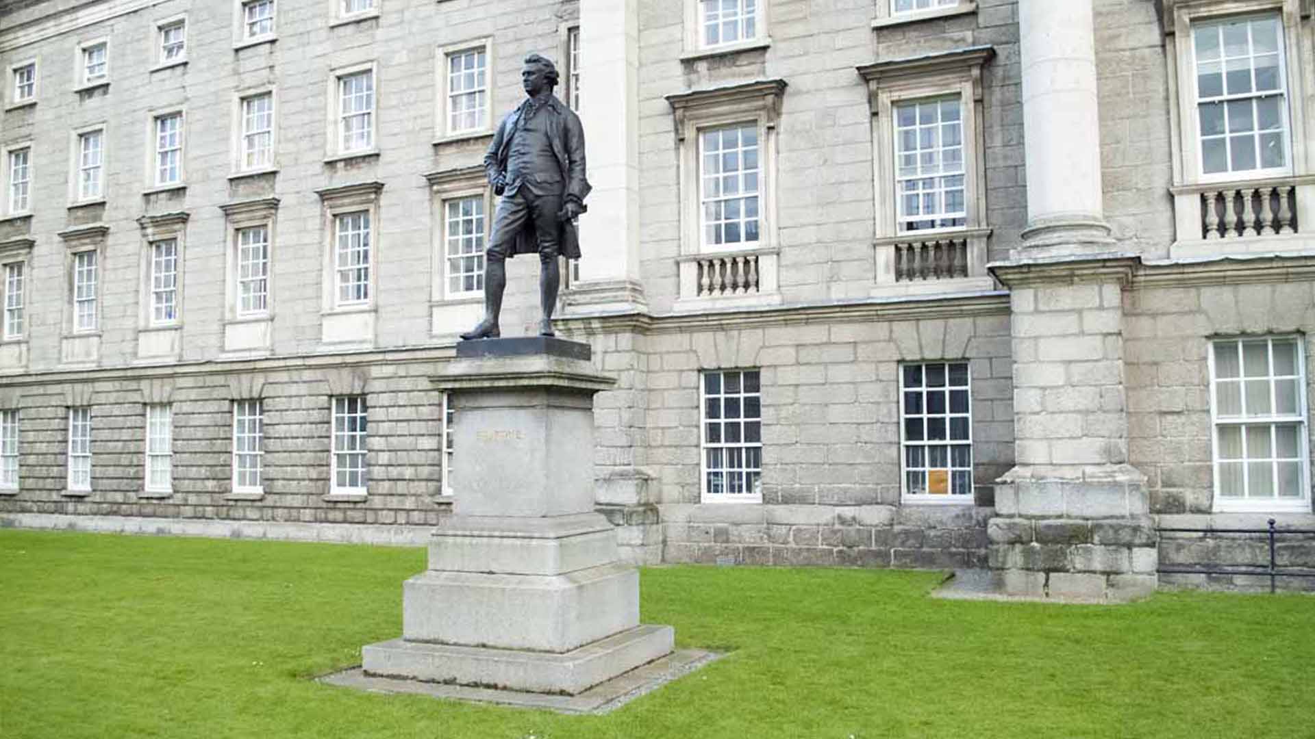 Edmund Burke Statue a statue of a man in front of a building