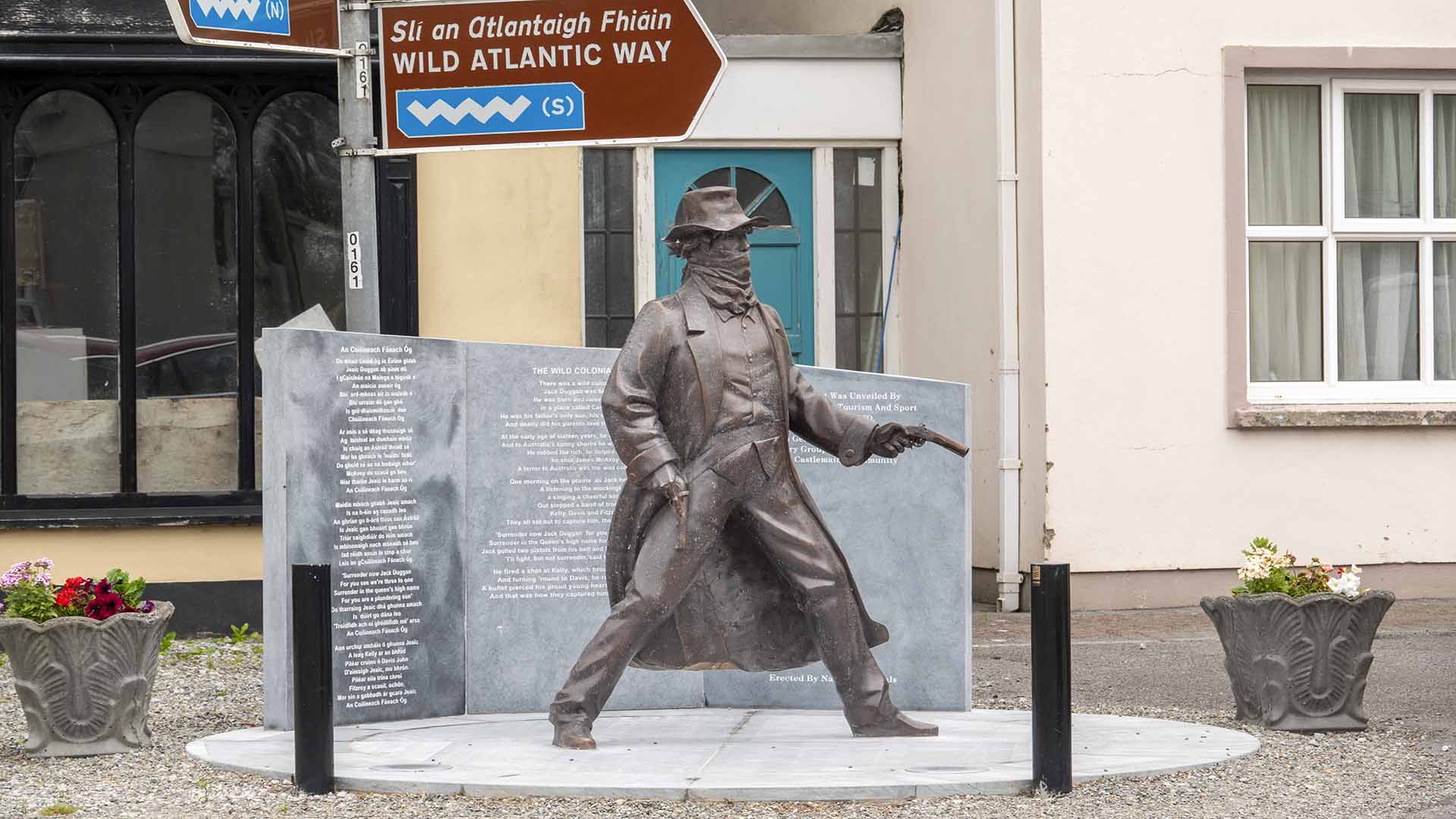 a statue of a man holding a gun