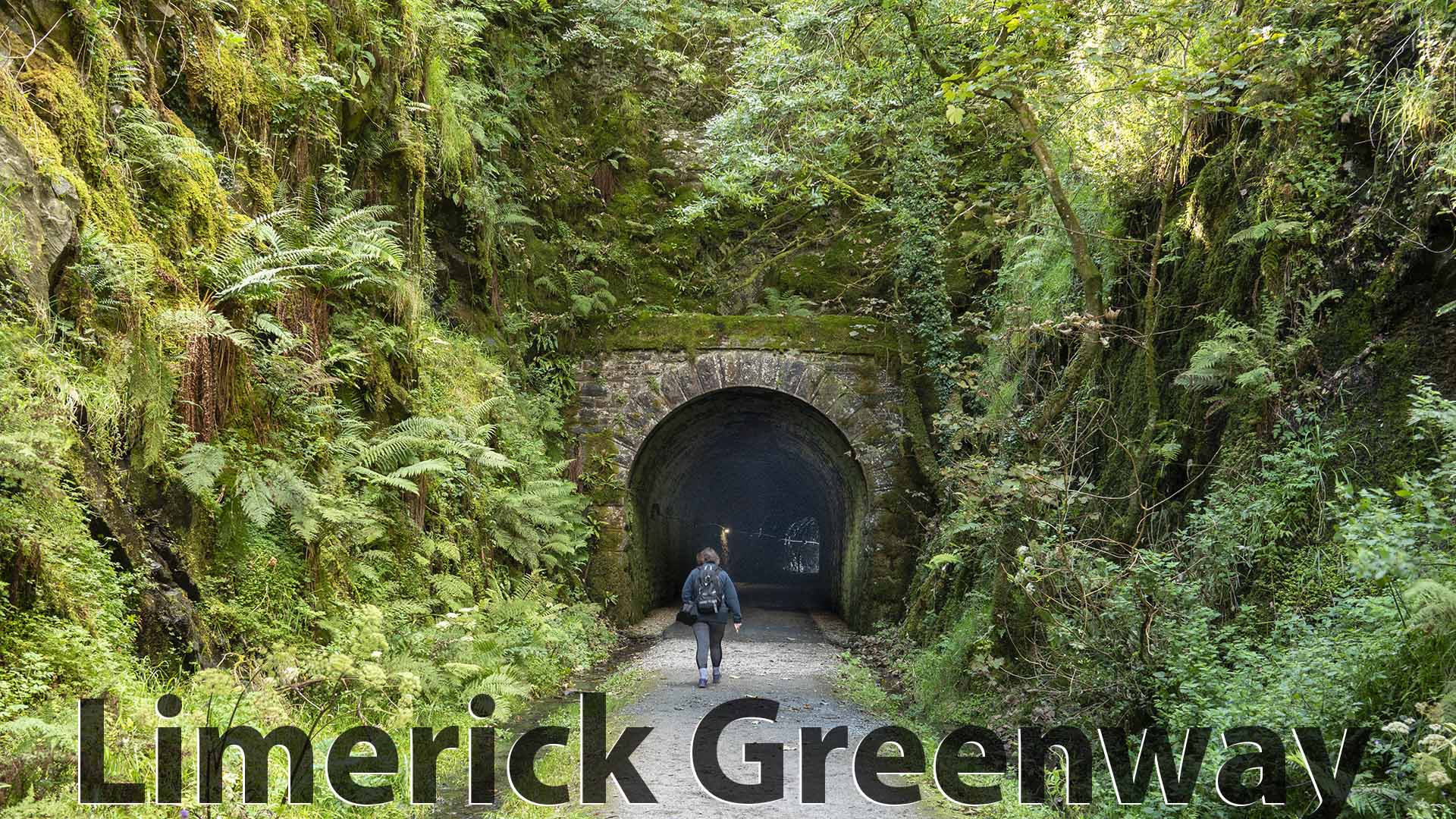 a person walking through a tunnel